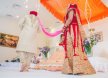How does Sikh Matrimony assist NRIs in finding suitable partners?
